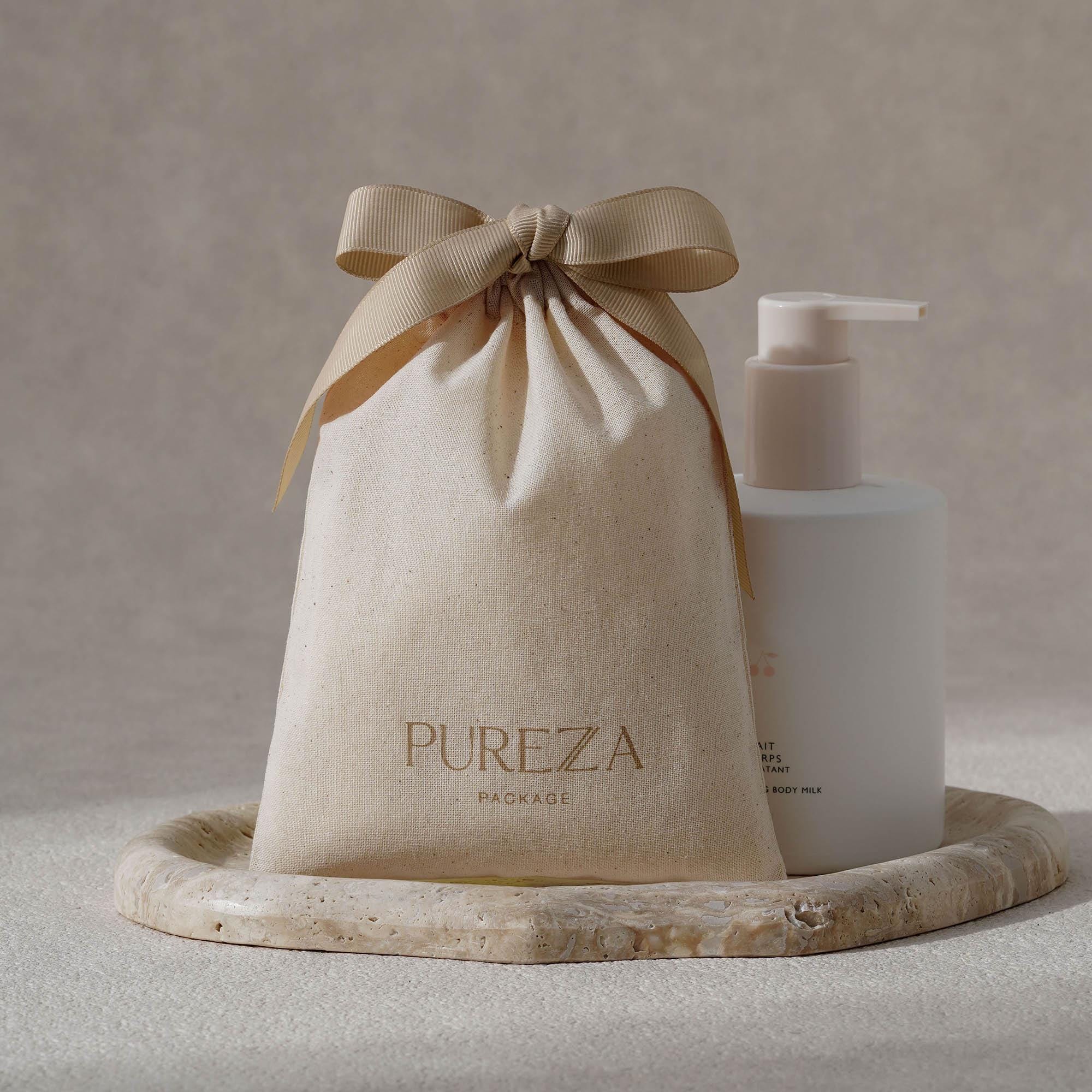 Pochette à cordon en coton nat - Luxury Skincare Gifts avis et prix
